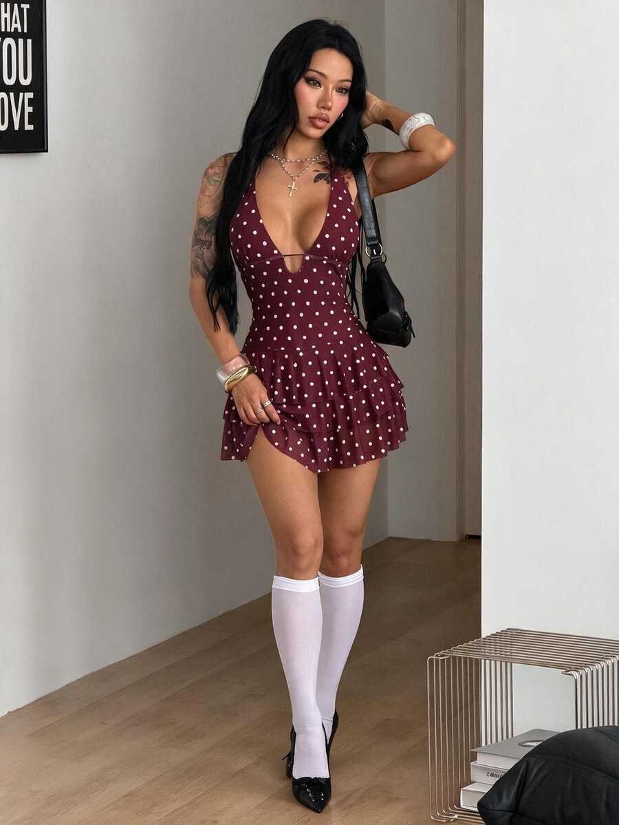 Front view of a women's lace halter mini dress featuring a slim-fit bodice, flared hem, and sleeveless design.