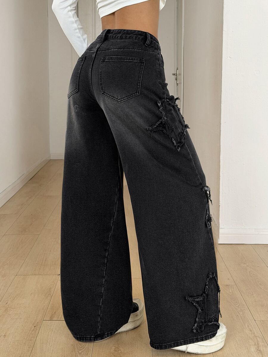 Front view of women's loose wide leg denim jeans featuring a mid waist, classic front pockets, and a zipper fly closure.