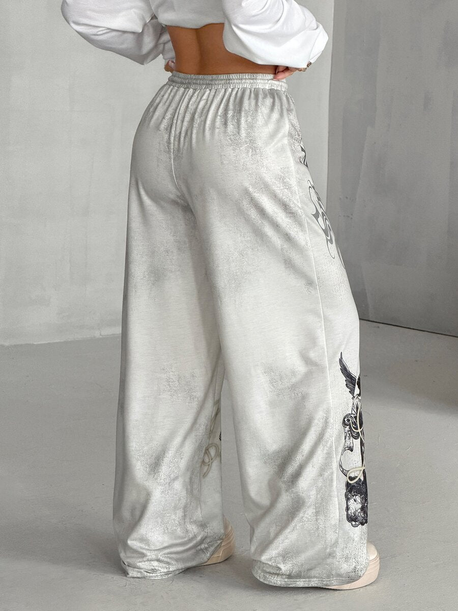 Women's loose fit wide leg graphic sweatpants in light grey with an elastic drawstring waistband