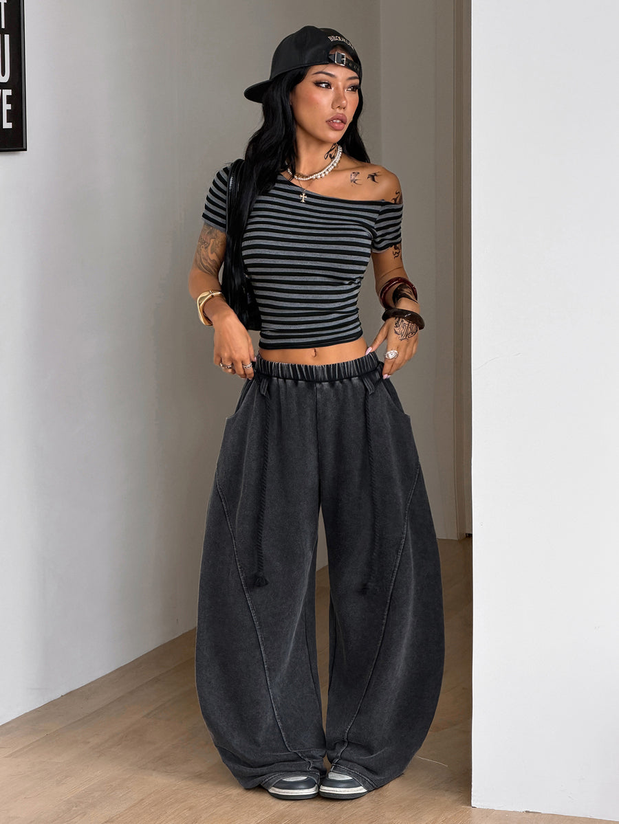 Women's casual grey plaid sweatpants featuring an elastic drawstring waistband, side pockets, and a relaxed loose fit.