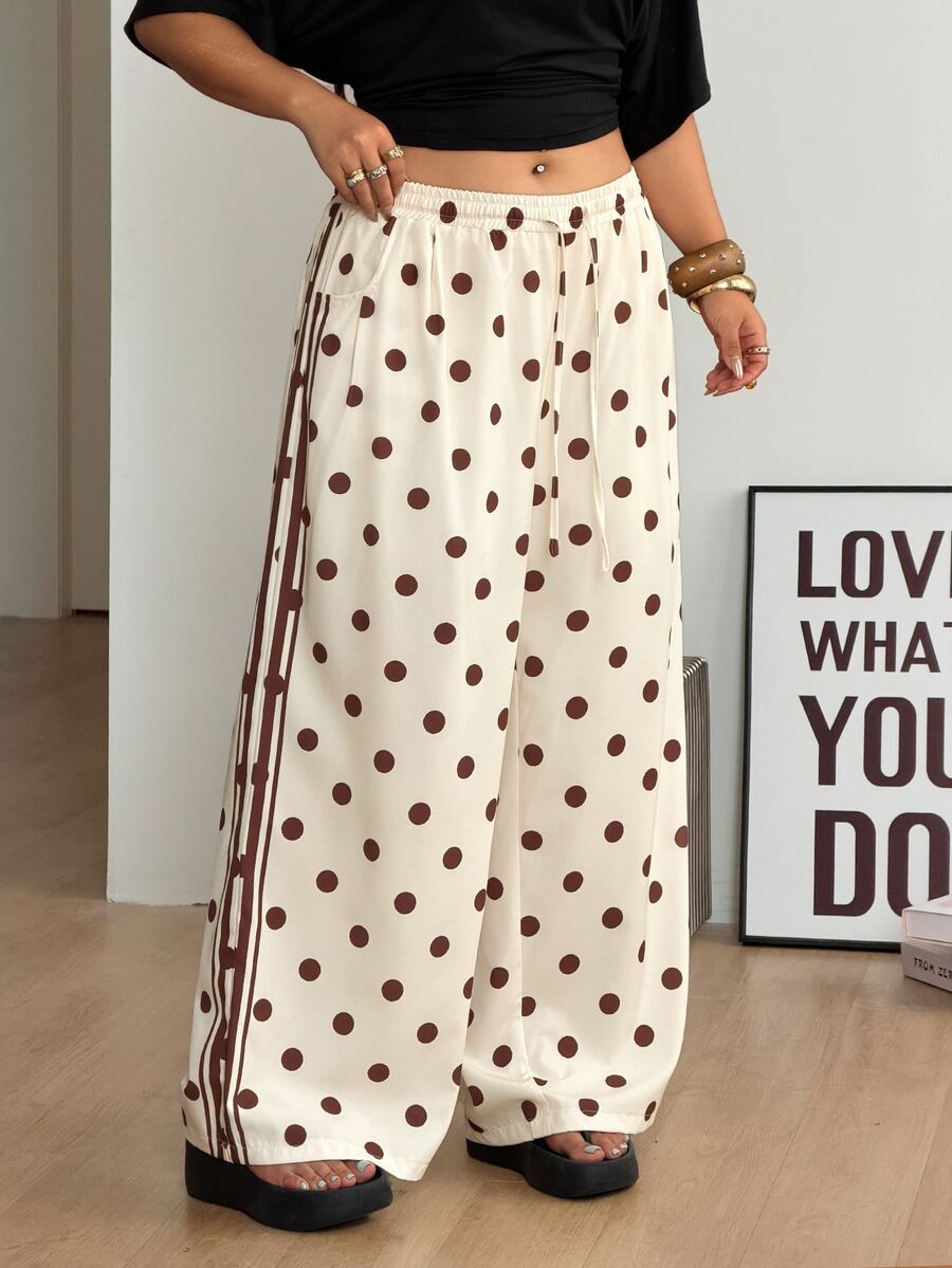 Women's loose straight leg cotton pants featuring a high waist with an adjustable drawstring knot and functional side pockets.