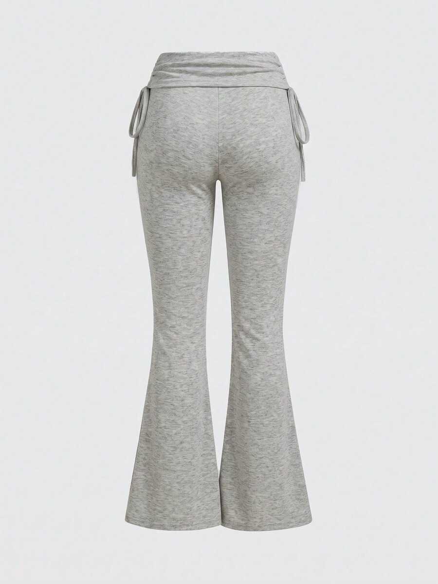 Women's low waist flare leg pants featuring an elastic drawstring waistband and ruched detail in knitted fabric.