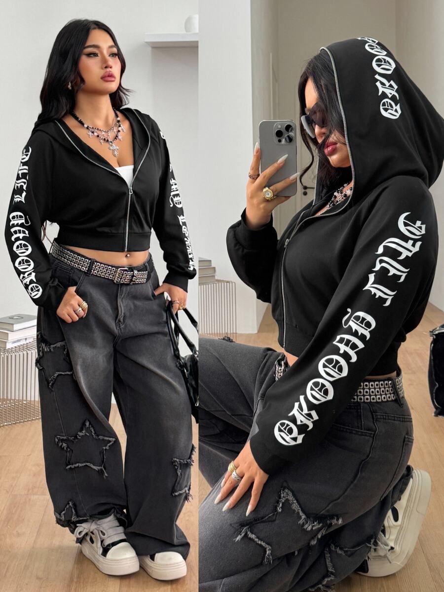 Black zip up hooded sweatshirt featuring Halloween graphic print, drawstring hood, long sleeves, and front zipper closure.