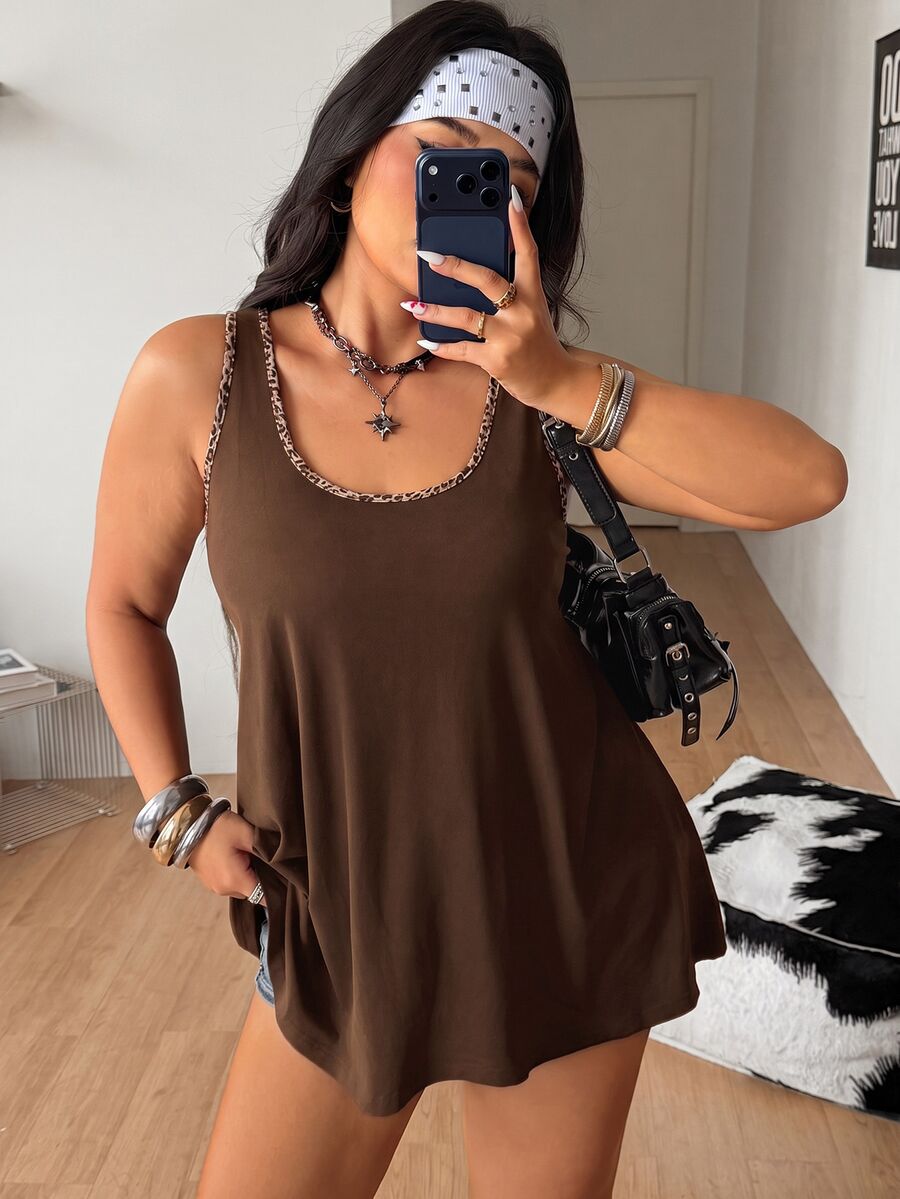 Women's camouflage print tank top featuring a scoop neckline and knitted stretch fabric in army green.