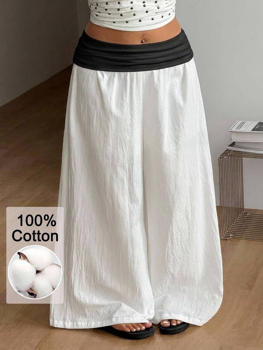 Women's plus size wide leg cotton pants featuring a relaxed loose fit and high waist design.