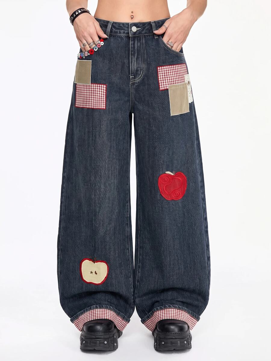 Women's loose baggy blue denim jeans featuring embroidered dragonfly and ladybug patch appliques, front pockets, and a straight-leg cut.