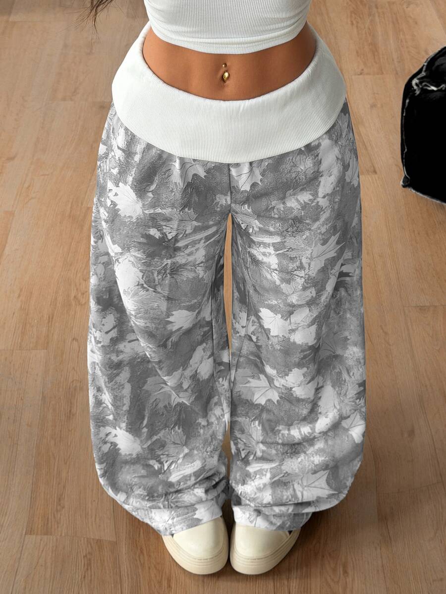 Women's wide leg trousers with a tree branch graphic pattern, loose fit, and mid-rise waist in woven fabric.