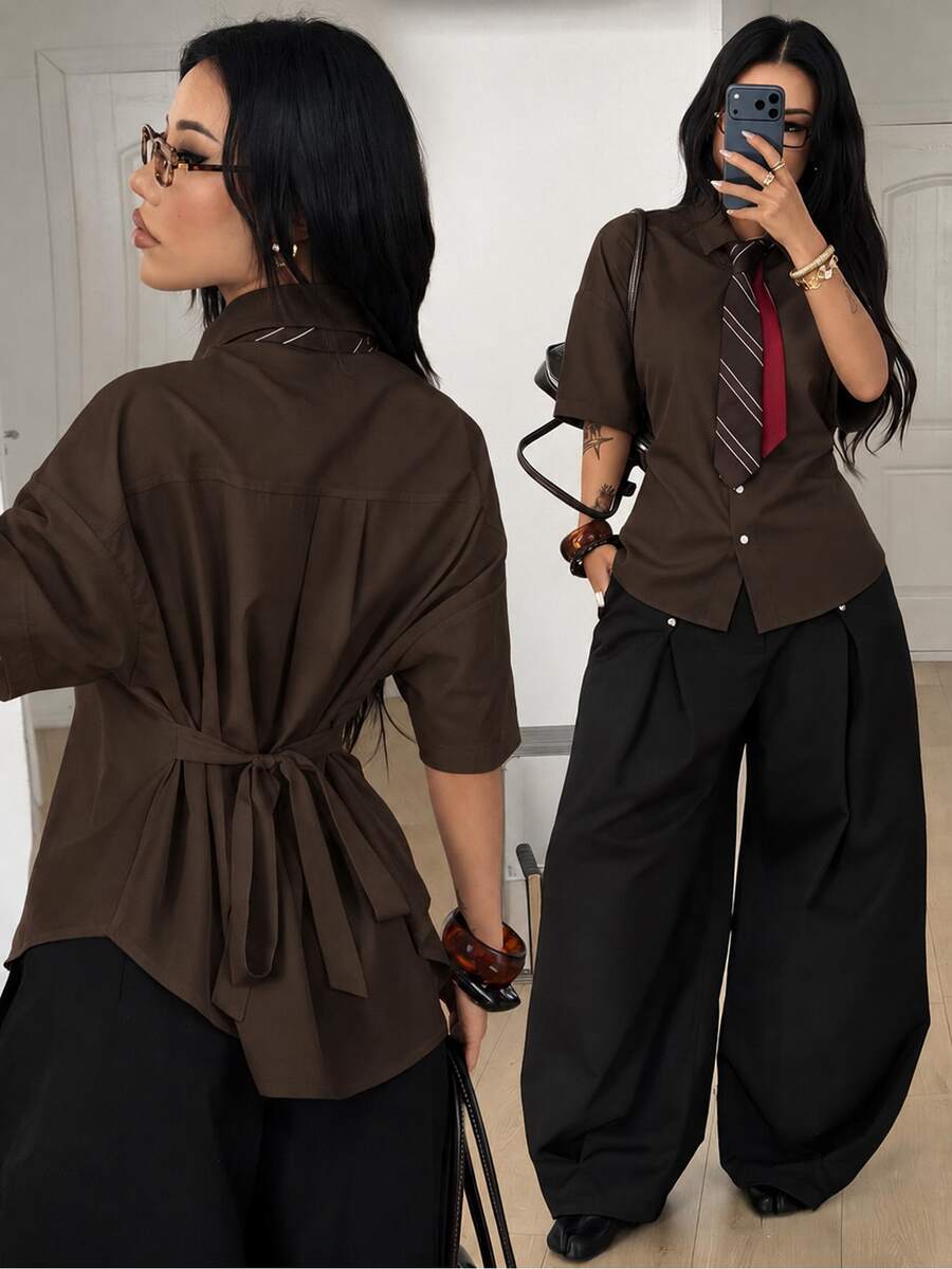 Women's casual button up shirt with half sleeves, classic shirt collar, and chest pocket in a woven fabric.