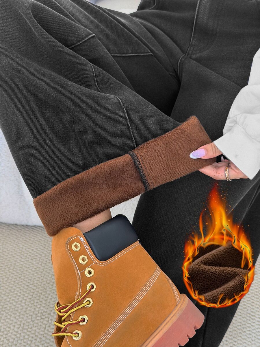 Women's loose wide-leg jeans in light wash denim with low waist and extra-long relaxed fit