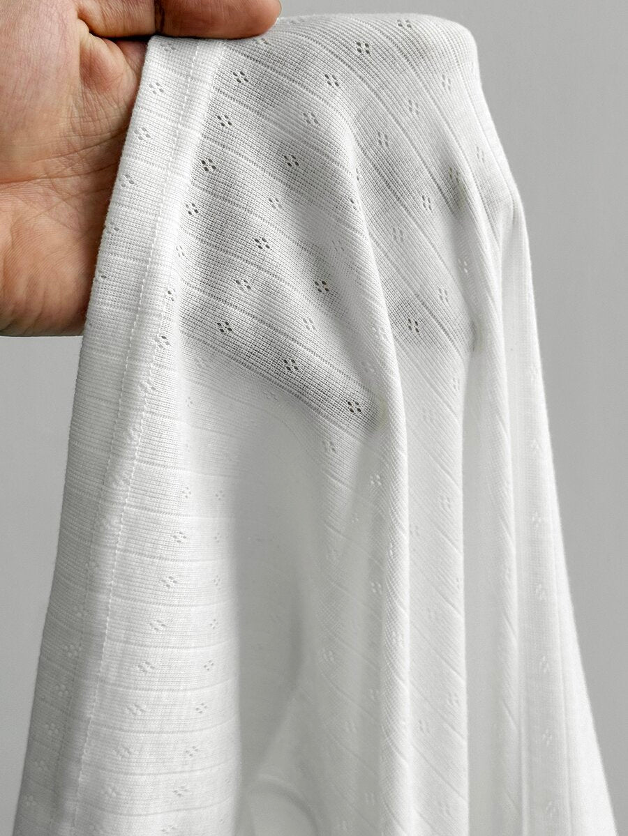 Women's slim fit ribbed knit henley shirt with long sleeves and front button placket detail.