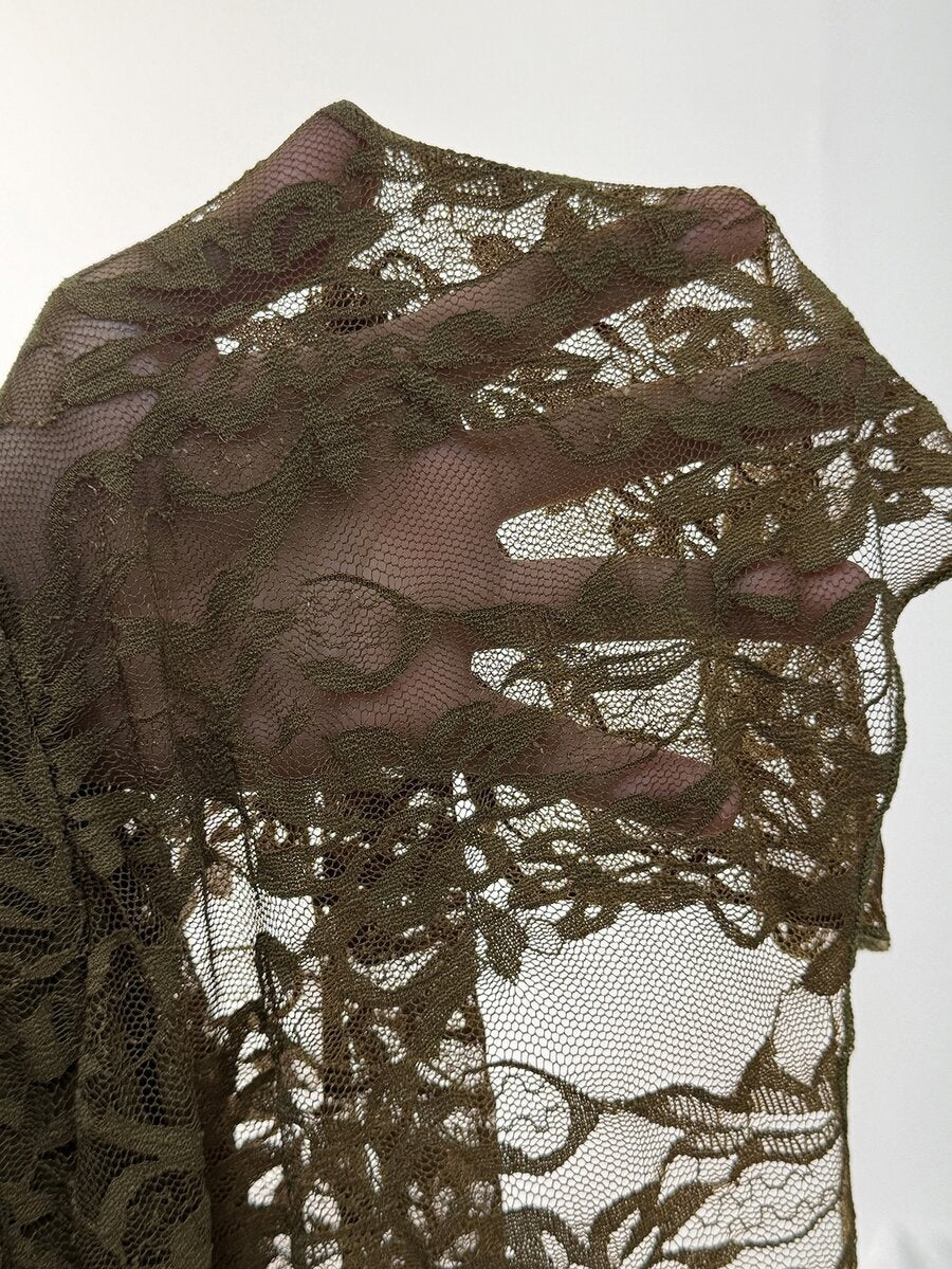 Women's floral lace mini skirt in white with asymmetrical ruffle trim and low waist design.