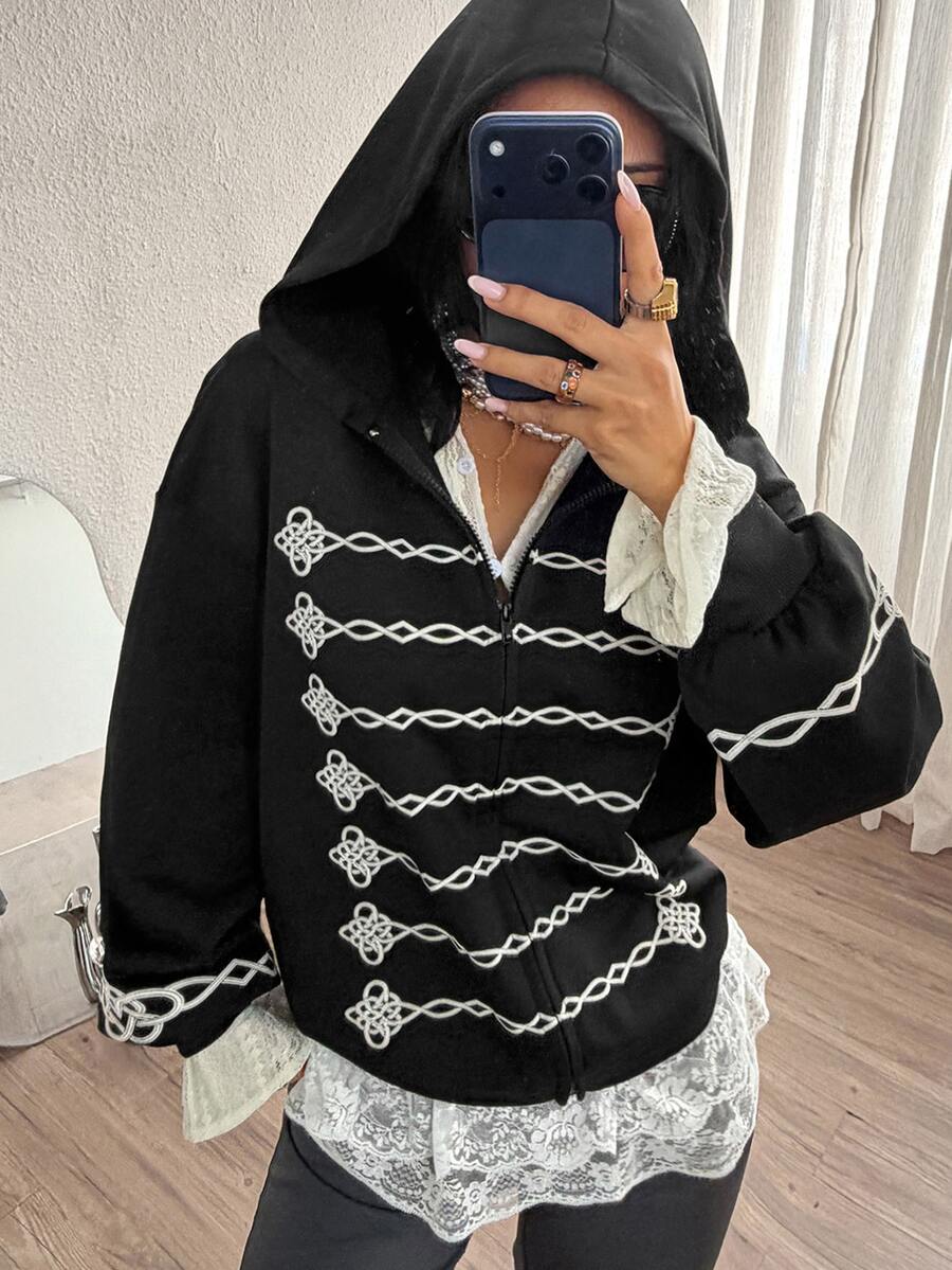 Women's army green camo zip up hoodie with drop shoulder sleeves, front pockets, and drawstring hood