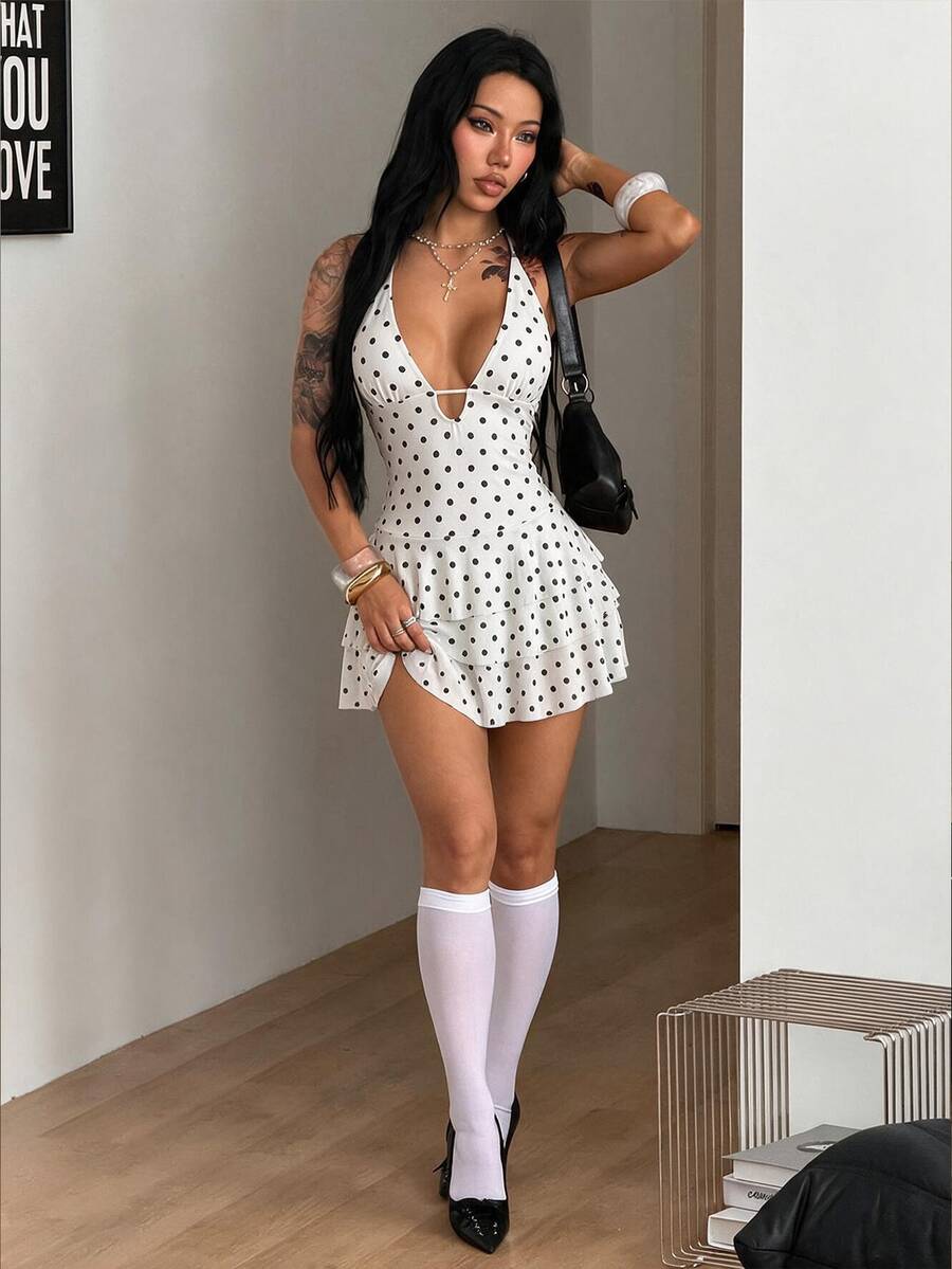 Front view of a women's lace halter mini dress featuring a slim-fit bodice, flared hem, and sleeveless design.