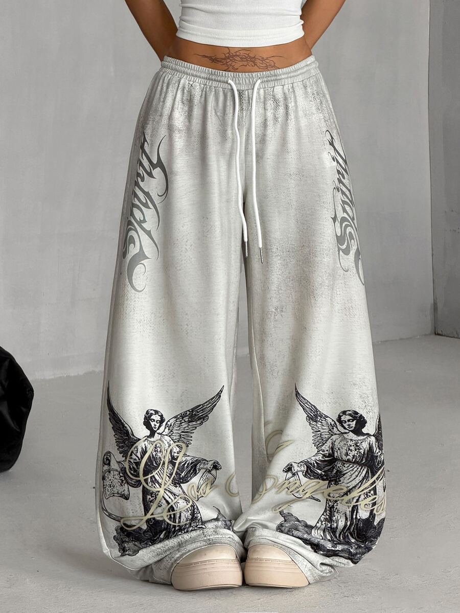 Women's loose fit wide leg graphic sweatpants in light grey with an elastic drawstring waistband