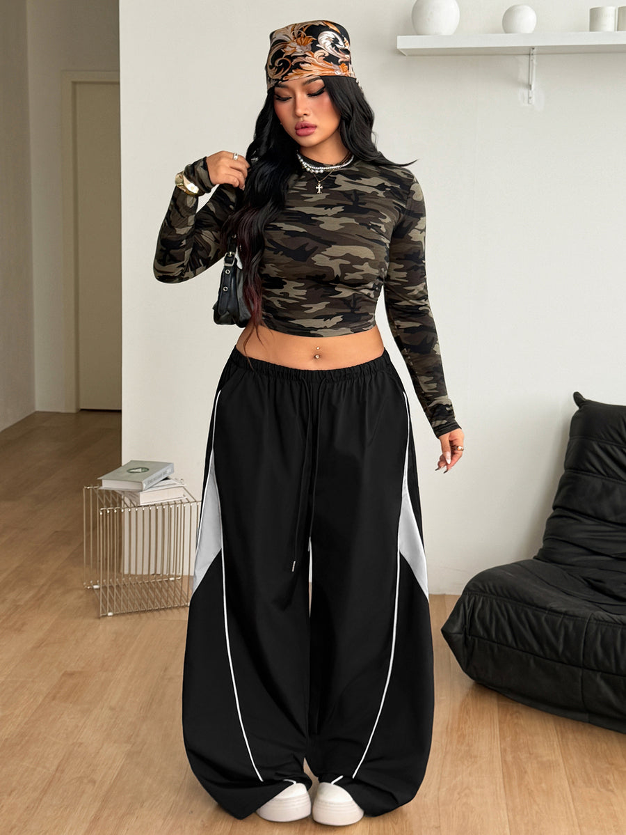 Plus size loose straight leg casual pants with elastic drawstring waist, contrast binding, and side pockets.