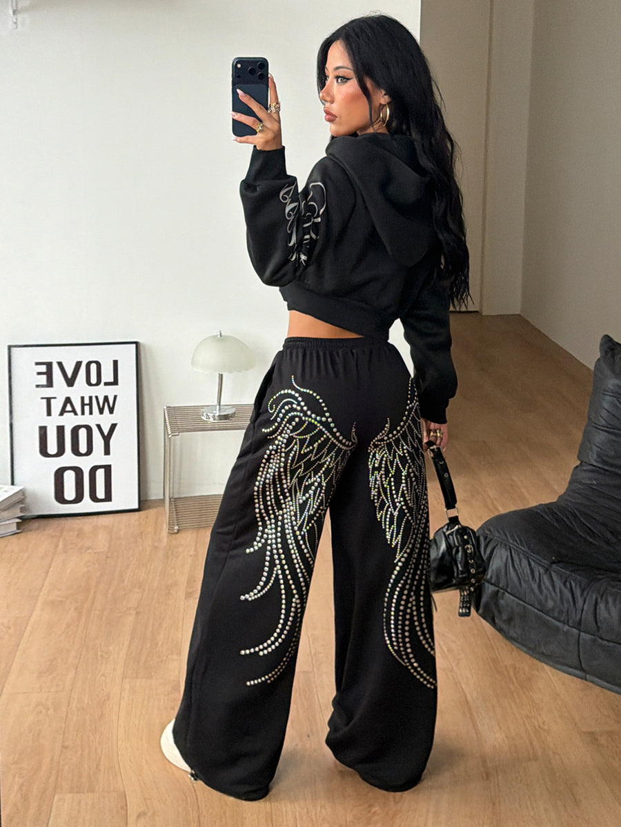 Women's loose fit wide leg graphic sweatpants in light grey with an elastic drawstring waistband