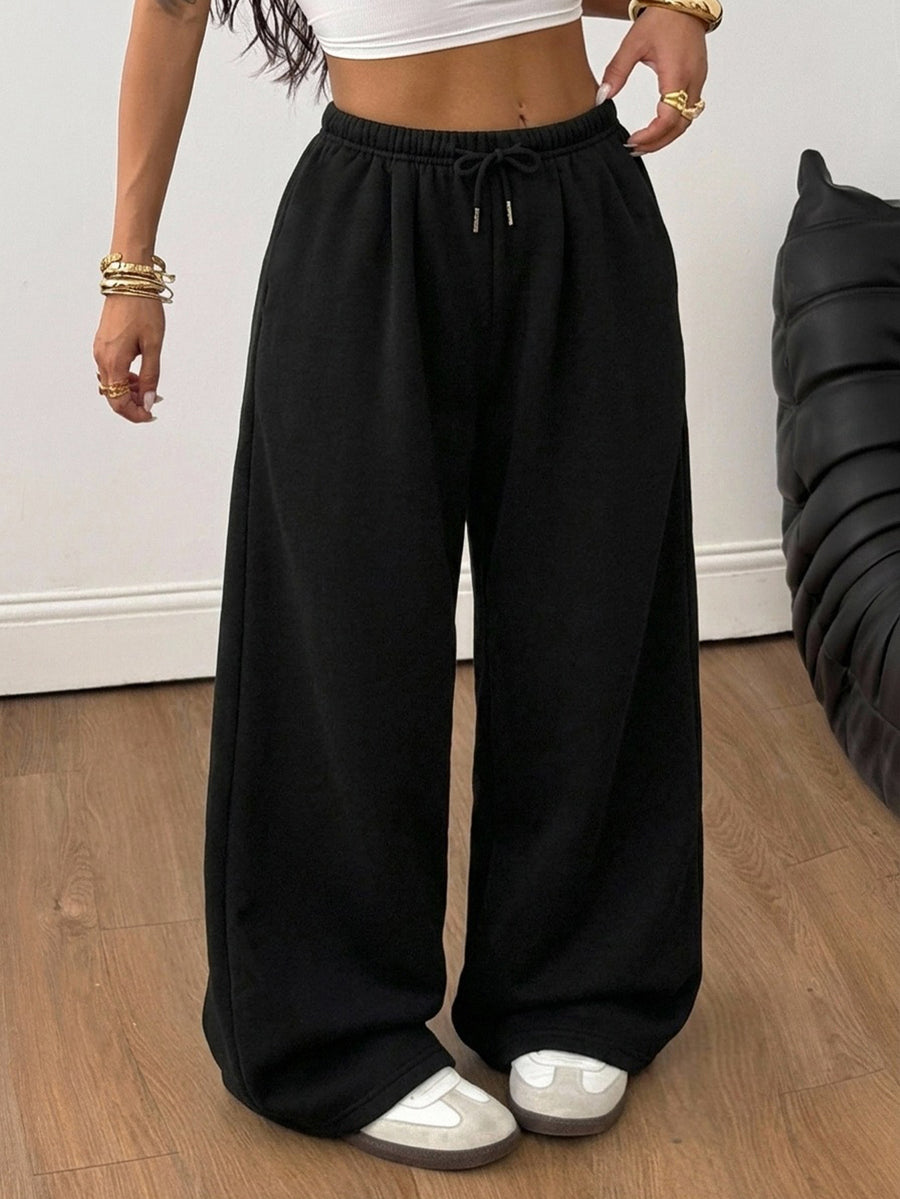 Women's loose wide leg casual sweatpants with an elastic waistband and side pockets