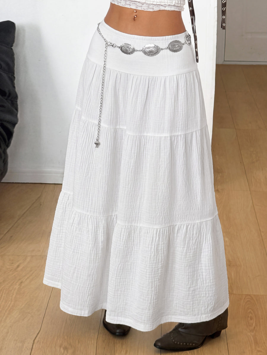 Women's red plaid long skirt featuring a low-rise waist and a side slit in lightweight woven fabric.