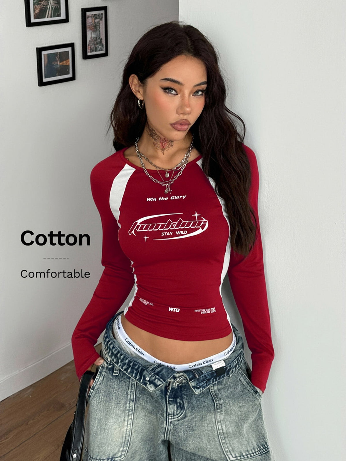 Women's slim fit long sleeve raglan t-shirt with collegiate letter graphic print, round neck, and contrast binding.