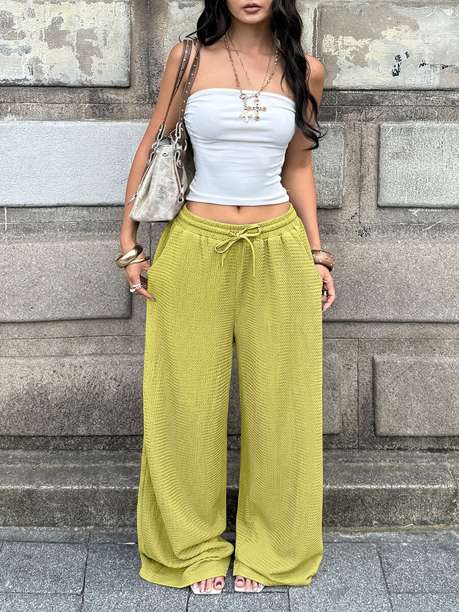 Women's loose fit straight leg lounge pants in textured knit fabric featuring an elastic drawstring waist and side pockets