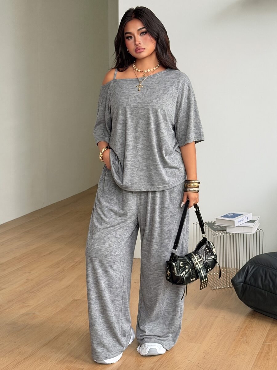 Women's two-piece lounge set featuring a loose drop shoulder asymmetrical neck short sleeve t-shirt and wide-leg knit pants with pockets.