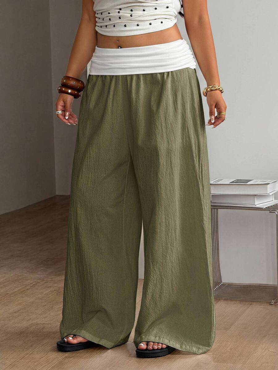 Women's plus size wide leg cotton pants featuring a relaxed loose fit and high waist design.