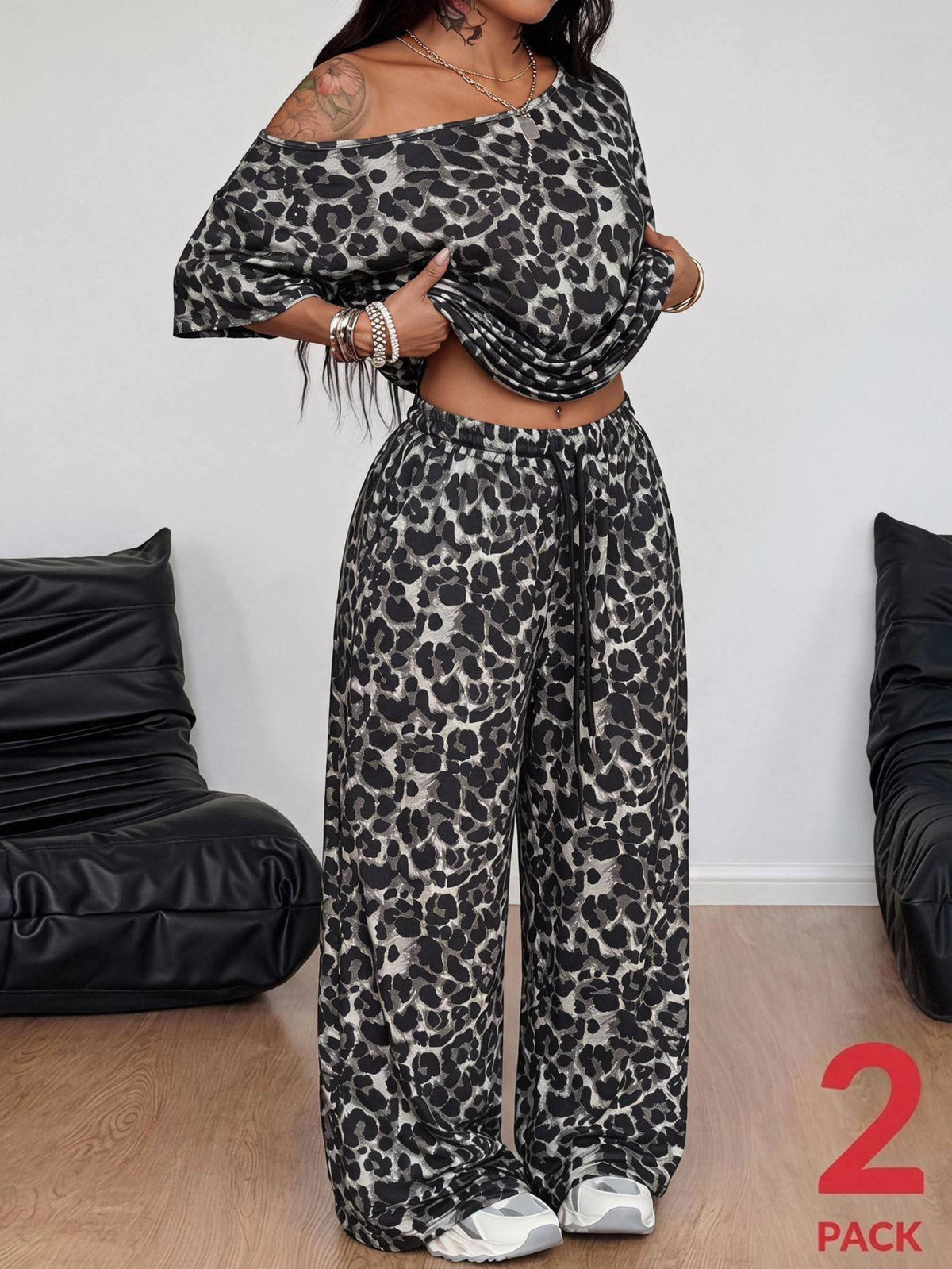 Women's two-piece lounge set featuring a loose drop shoulder asymmetrical neck short sleeve t-shirt and wide-leg knit pants with pockets.