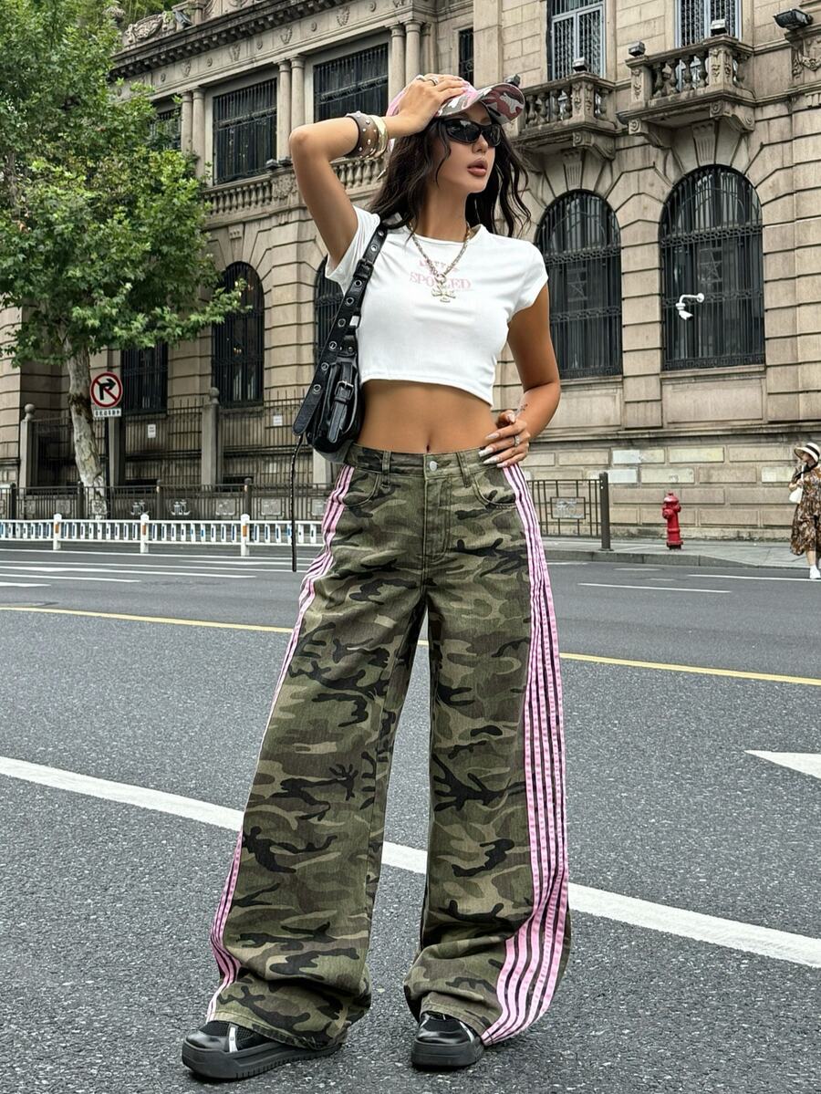 Front view of women's loose wide leg denim jeans featuring a mid waist, classic front pockets, and a zipper fly closure.