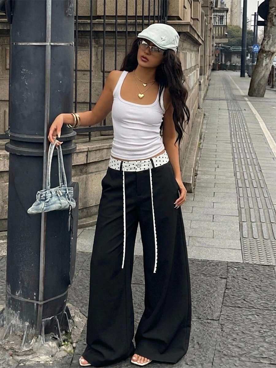 Women's casual straight leg striped woven pants featuring a low waist and zipper fly closure.
