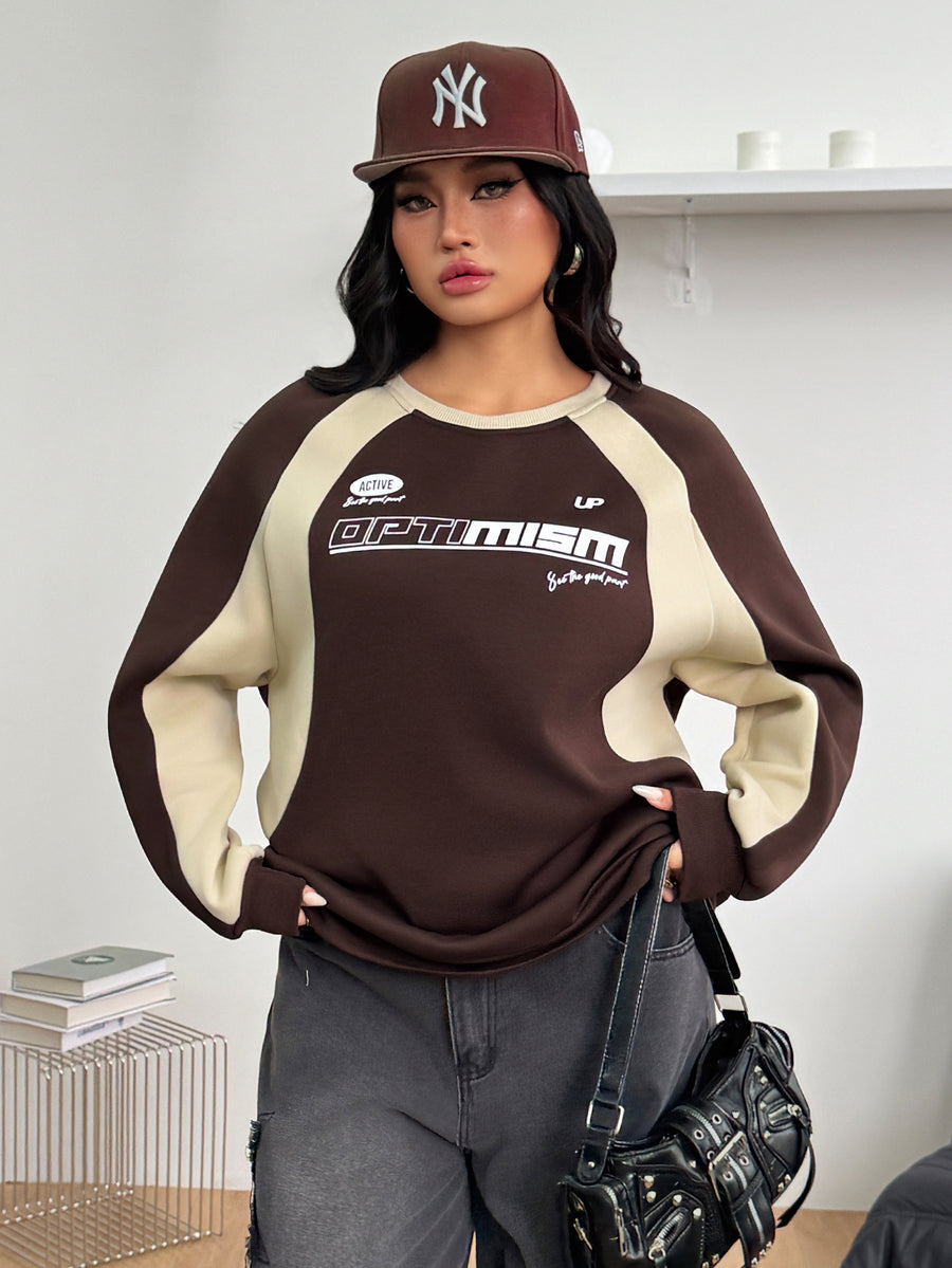 Color-blocked loose pullover sweatshirt with a round neckline, raglan sleeves, and ribbed knit trim.
