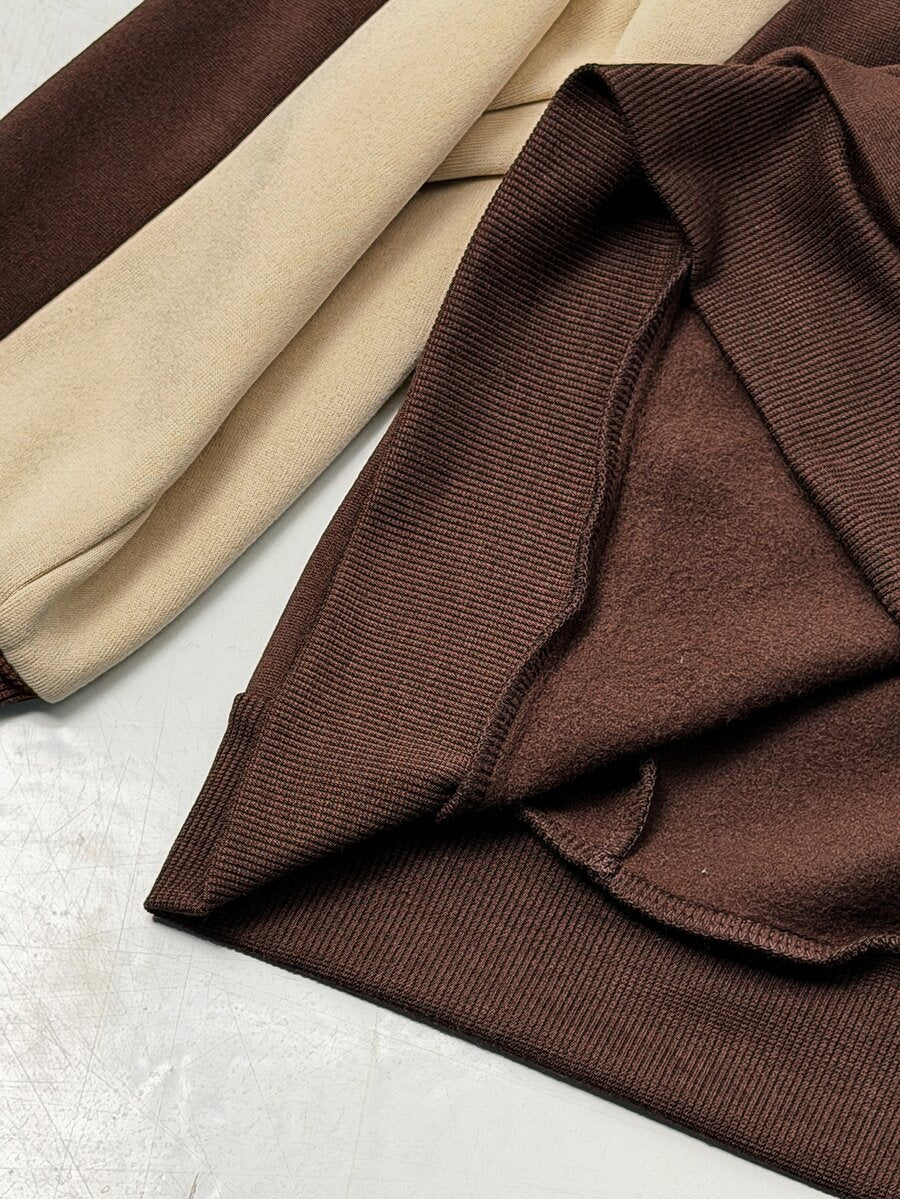 Color-blocked loose pullover sweatshirt with a round neckline, raglan sleeves, and ribbed knit trim.