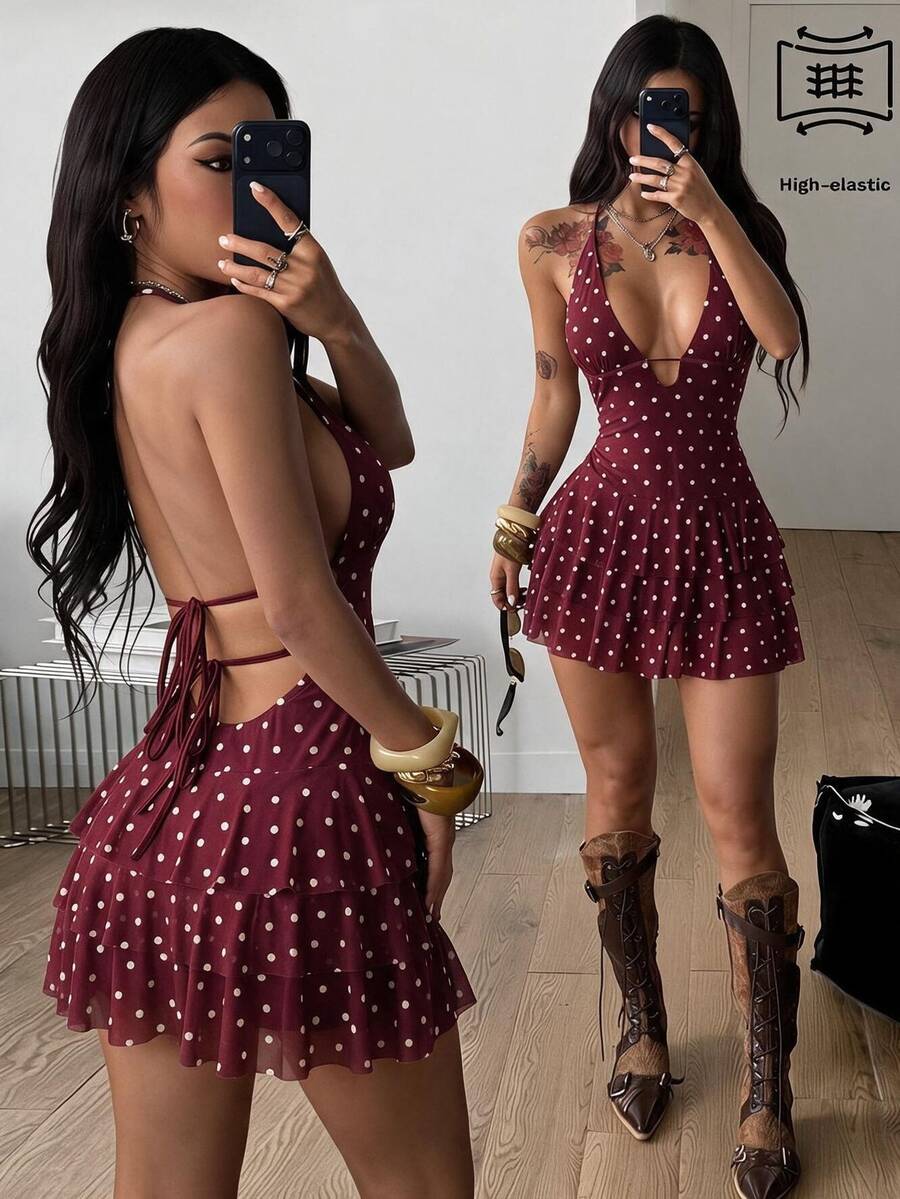 Front view of a women's lace halter mini dress featuring a slim-fit bodice, flared hem, and sleeveless design.