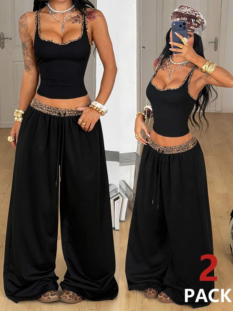 Women's two-piece casual outfit featuring a slim-fit camisole tank top with ruffle trim and button front paired with high-waisted wide leg pants.