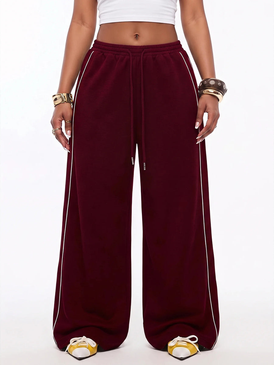 Women's wide leg trousers with a tree branch graphic pattern, loose fit, and mid-rise waist in woven fabric.