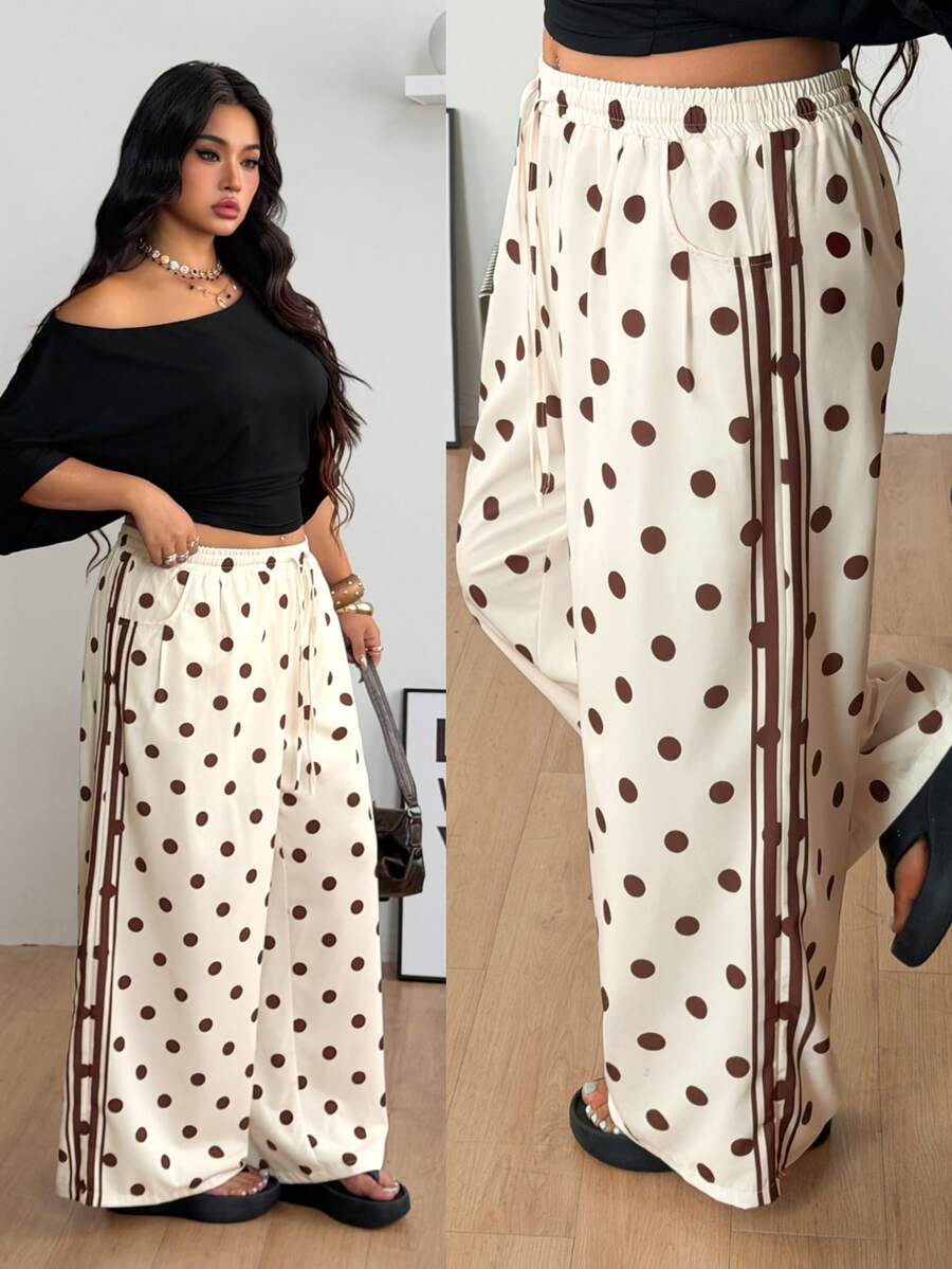 Women's loose straight leg cotton pants featuring a high waist with an adjustable drawstring knot and functional side pockets.