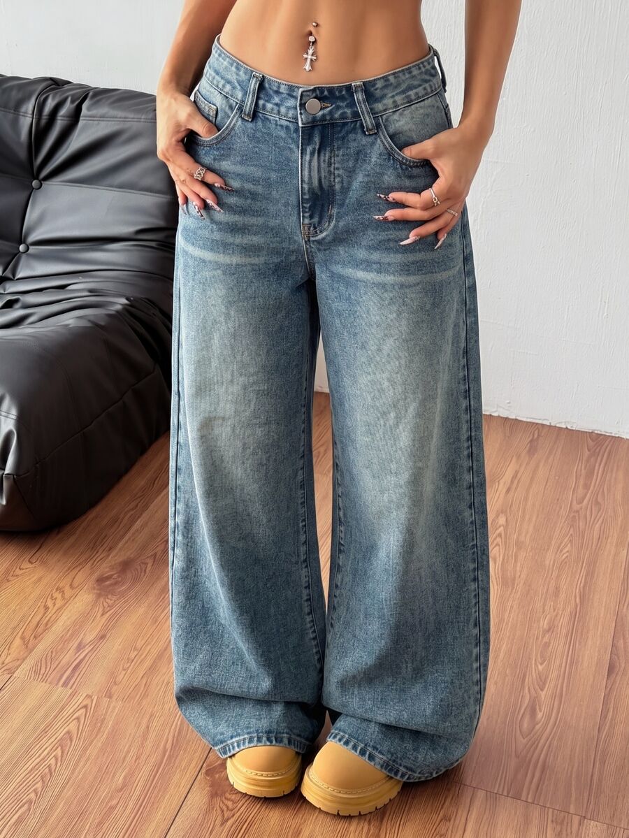 Women's relaxed fit wide leg denim jeans with pockets and a zipper fly.