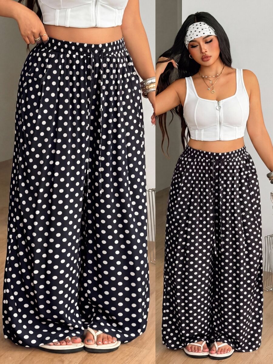 Plus size women's striped loose straight leg cropped pants with pleated detailing and side pockets