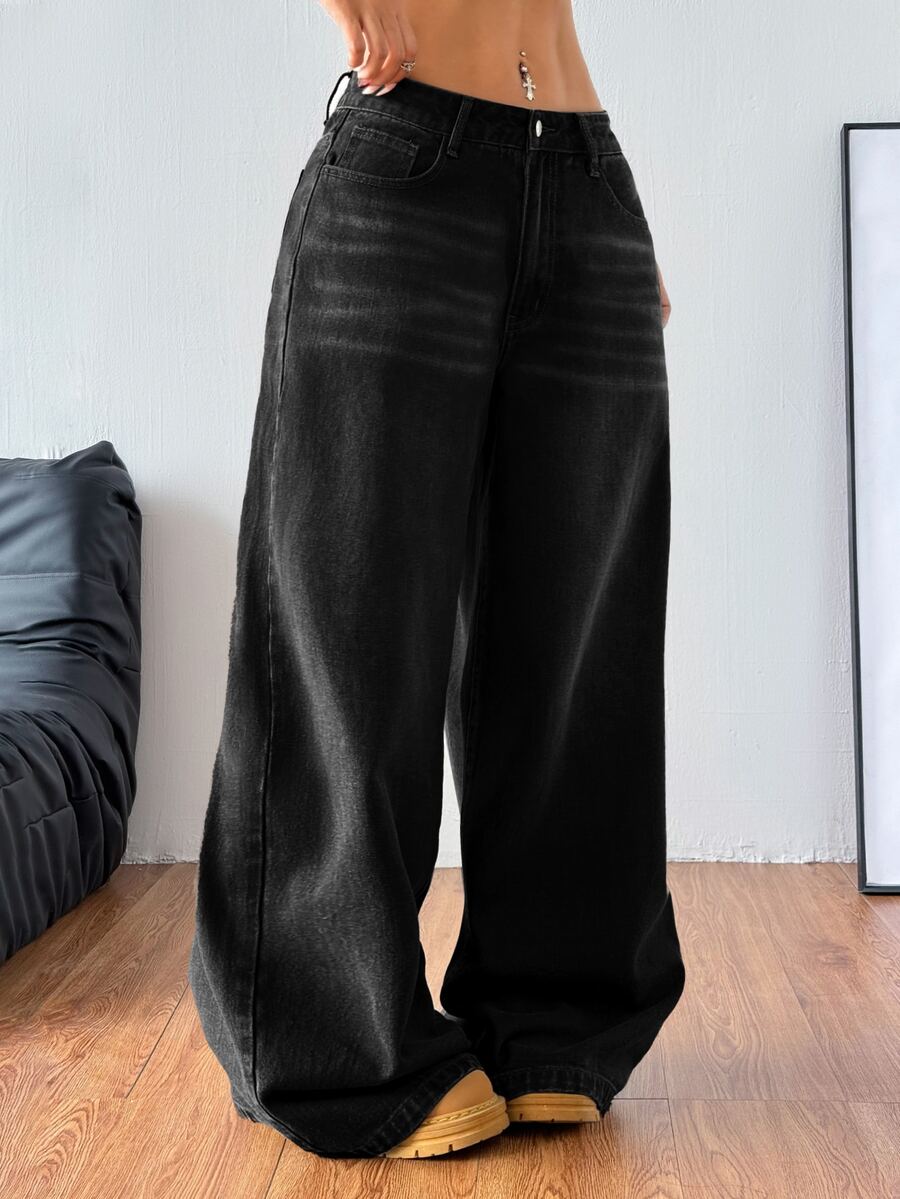 Women's relaxed fit wide leg denim jeans with pockets and a zipper fly.