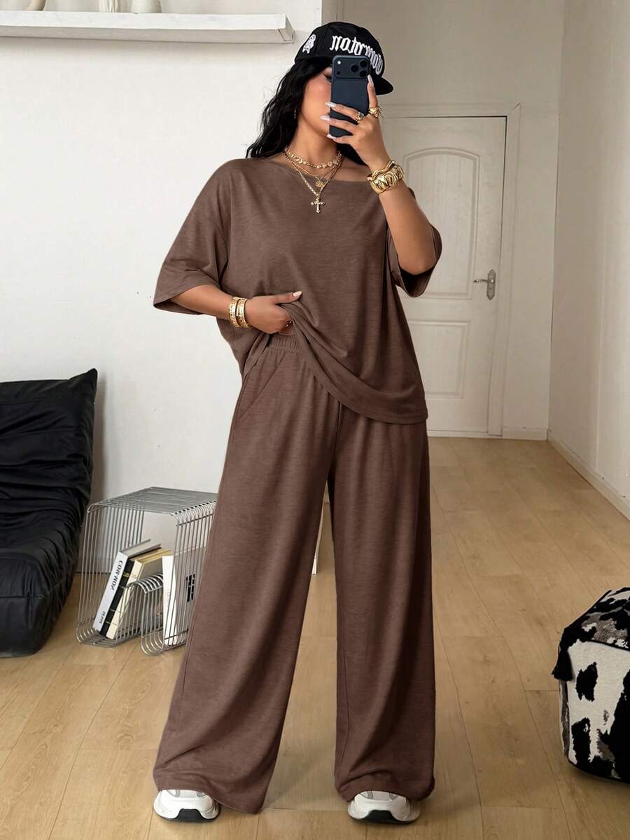 Women's two-piece lounge set featuring a loose drop shoulder asymmetrical neck short sleeve t-shirt and wide-leg knit pants with pockets.
