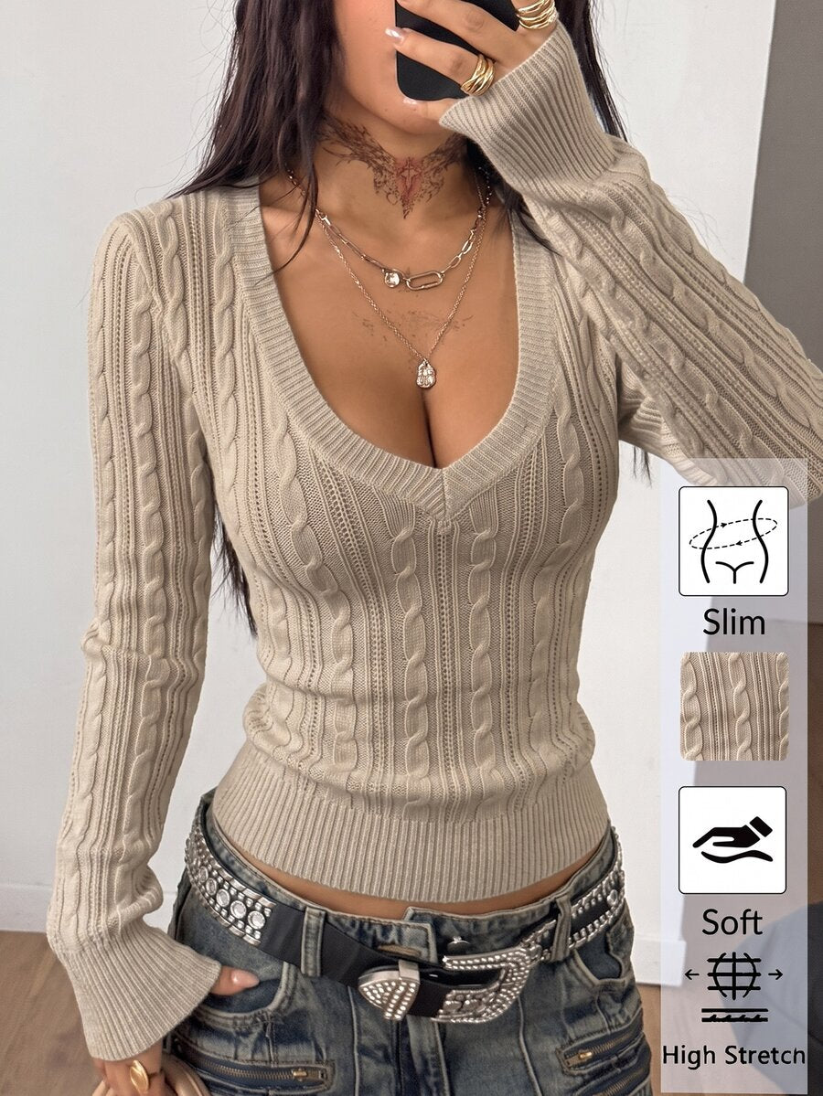 Women's slim fit cable-knit long sleeve sweater featuring a V-neckline and ribbed knit details.