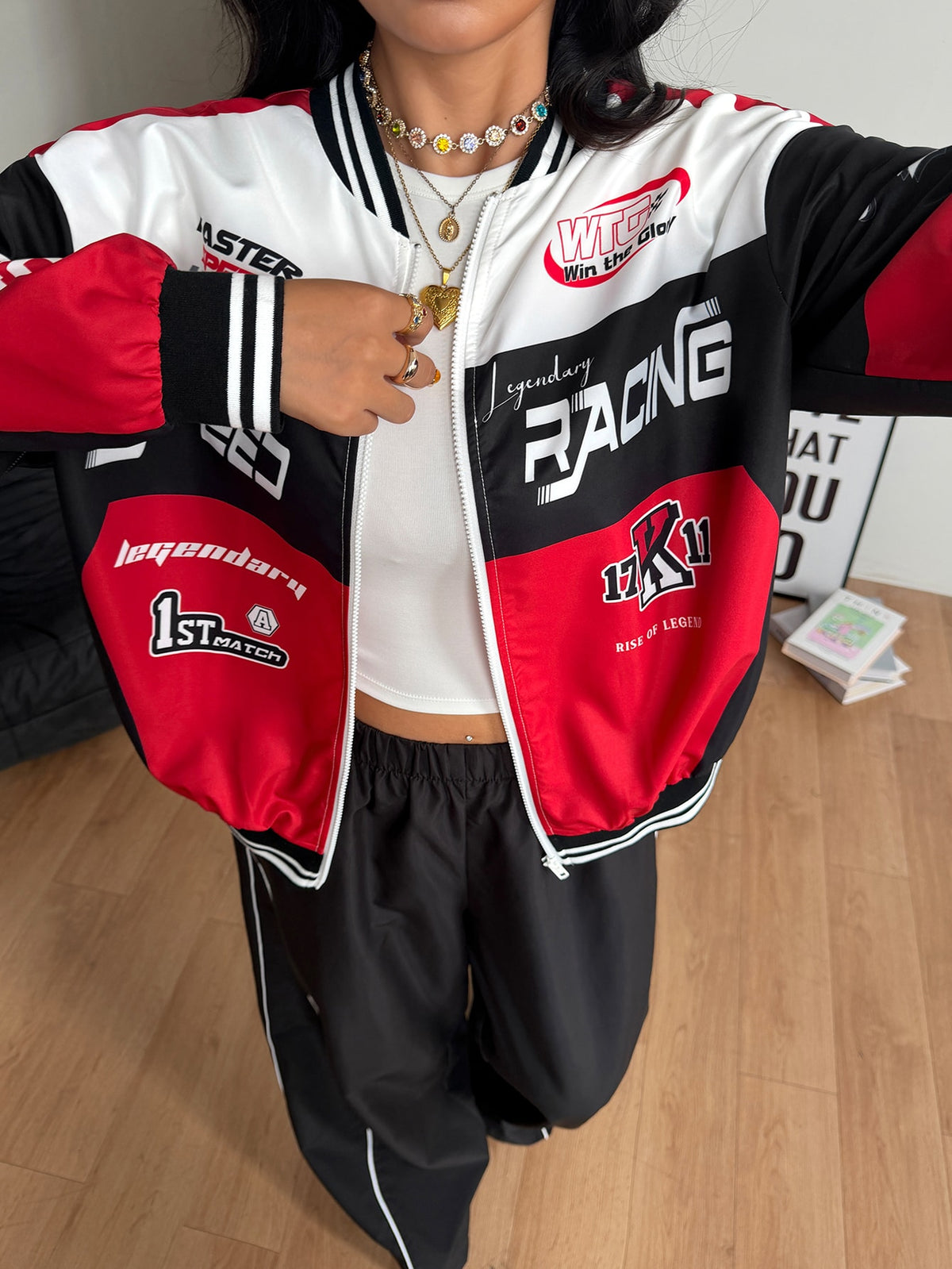 Unisex plus size red and black colorblock baseball bomber jacket with front zipper closure and drop shoulder long sleeves.