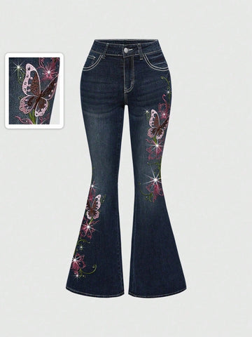 Women's blue ultra low waist flare jeans with butterfly vine embroidery and rhinestone detailing on stretch denim.