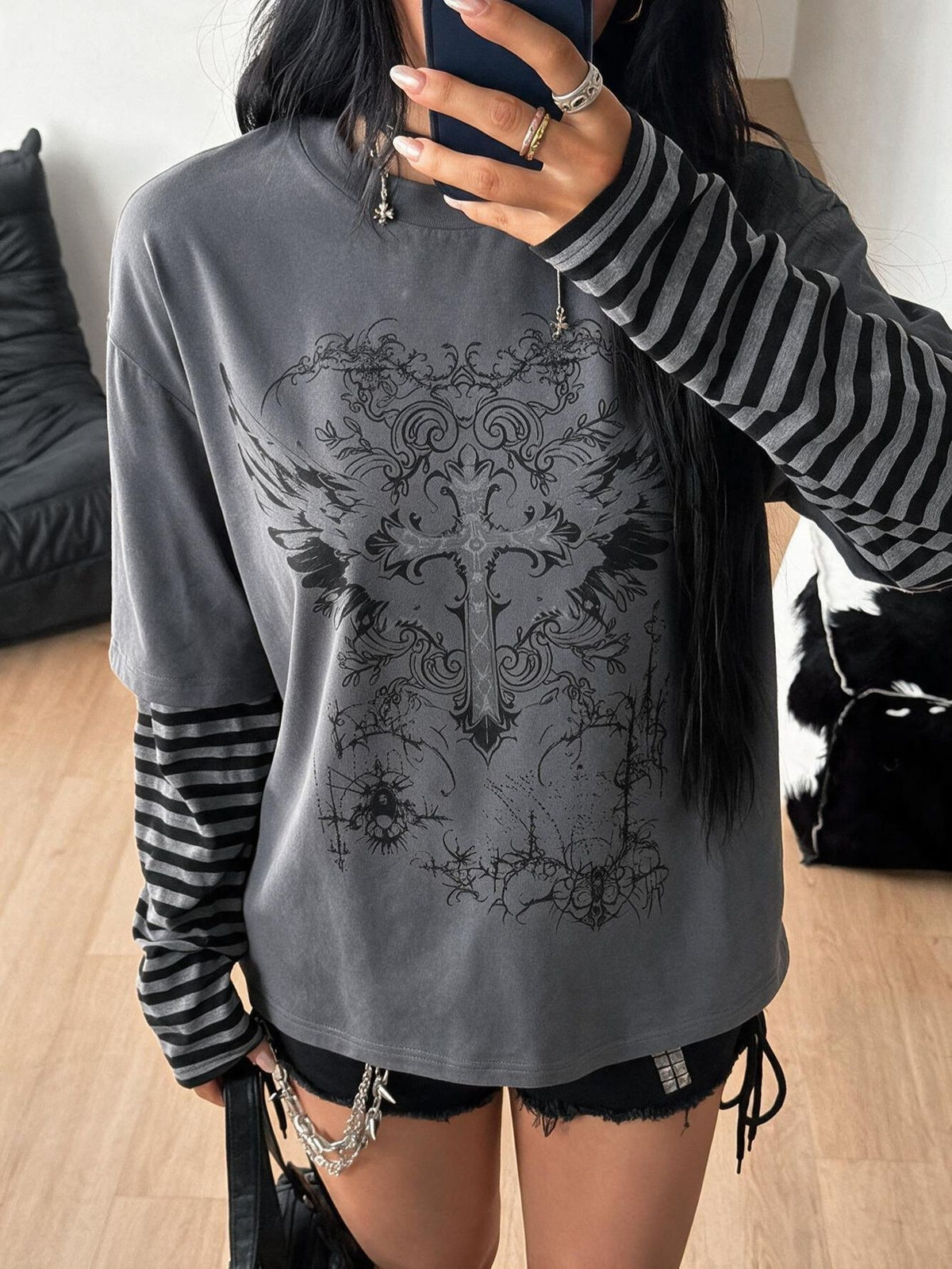 Women's casual graphic long sleeve t-shirt with a round neck, drop shoulder sleeves, and loose relaxed fit.