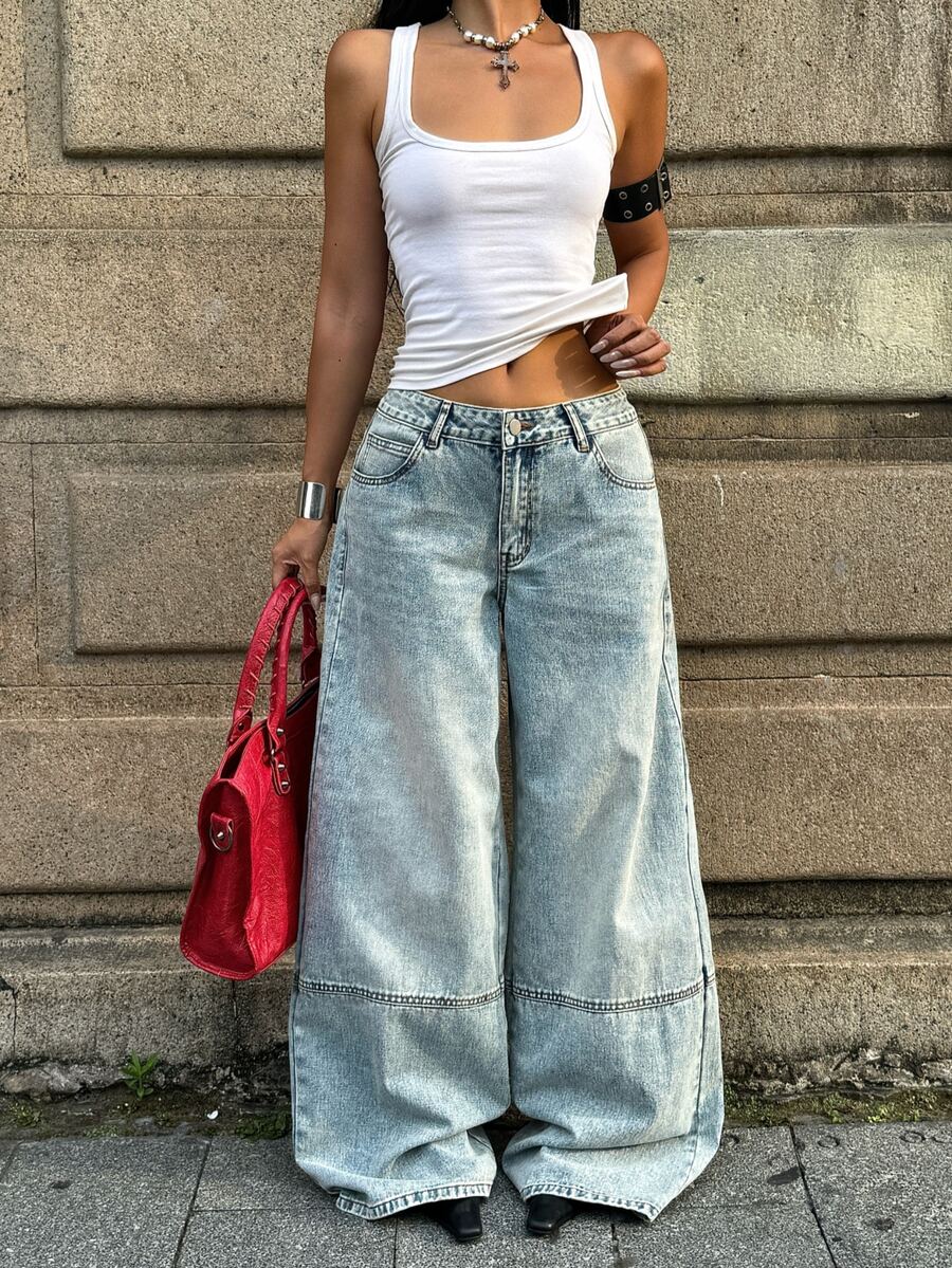 Women's loose wide-leg jeans in light wash denim with low waist and extra-long relaxed fit