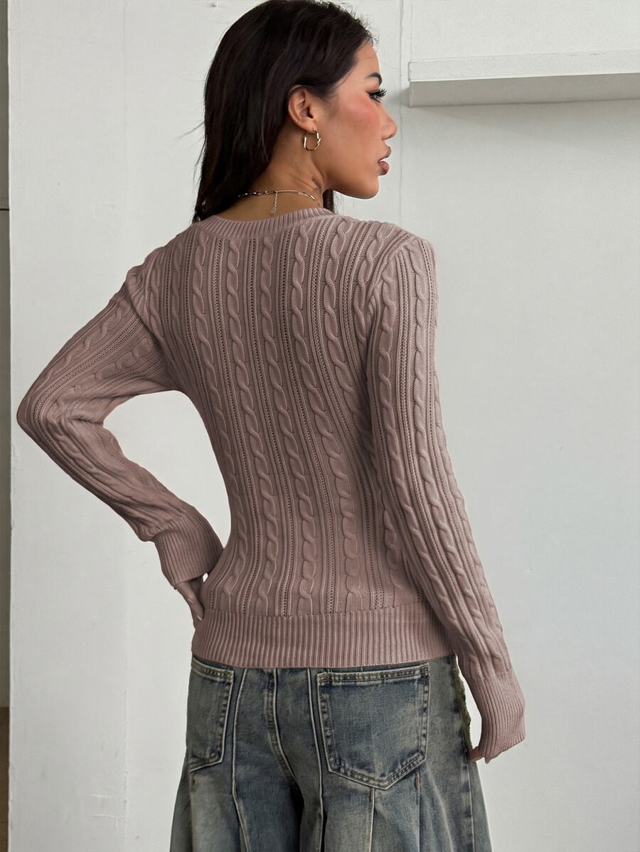 Women's slim fit cable-knit long sleeve sweater featuring a V-neckline and ribbed knit details.