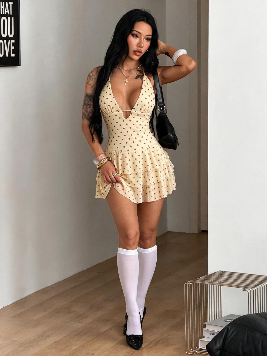 Front view of a women's lace halter mini dress featuring a slim-fit bodice, flared hem, and sleeveless design.