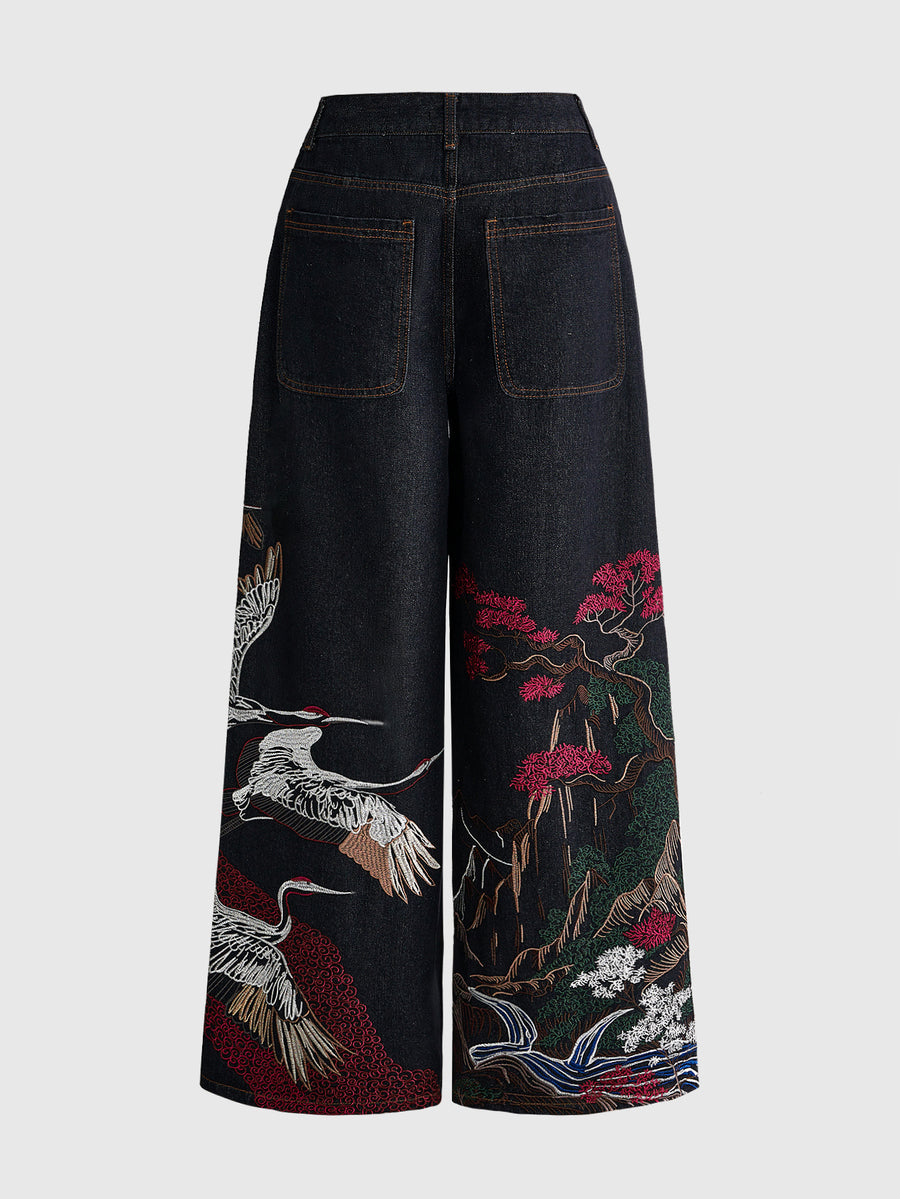 Women's black loose wide leg jeans with detailed crane and landscape embroidery, zipper fly, and ultra low waist.