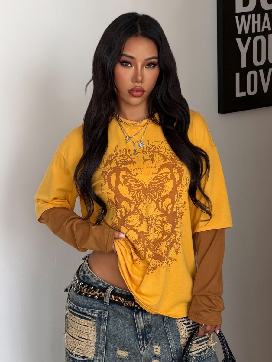 Women's casual graphic long sleeve t-shirt with a round neck, drop shoulder sleeves, and loose relaxed fit.