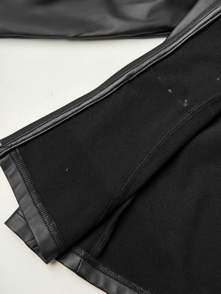 Black plus size women's slim fit zip-up jacket with a high neck and extra-long sleeves crafted in stretch PU fabric