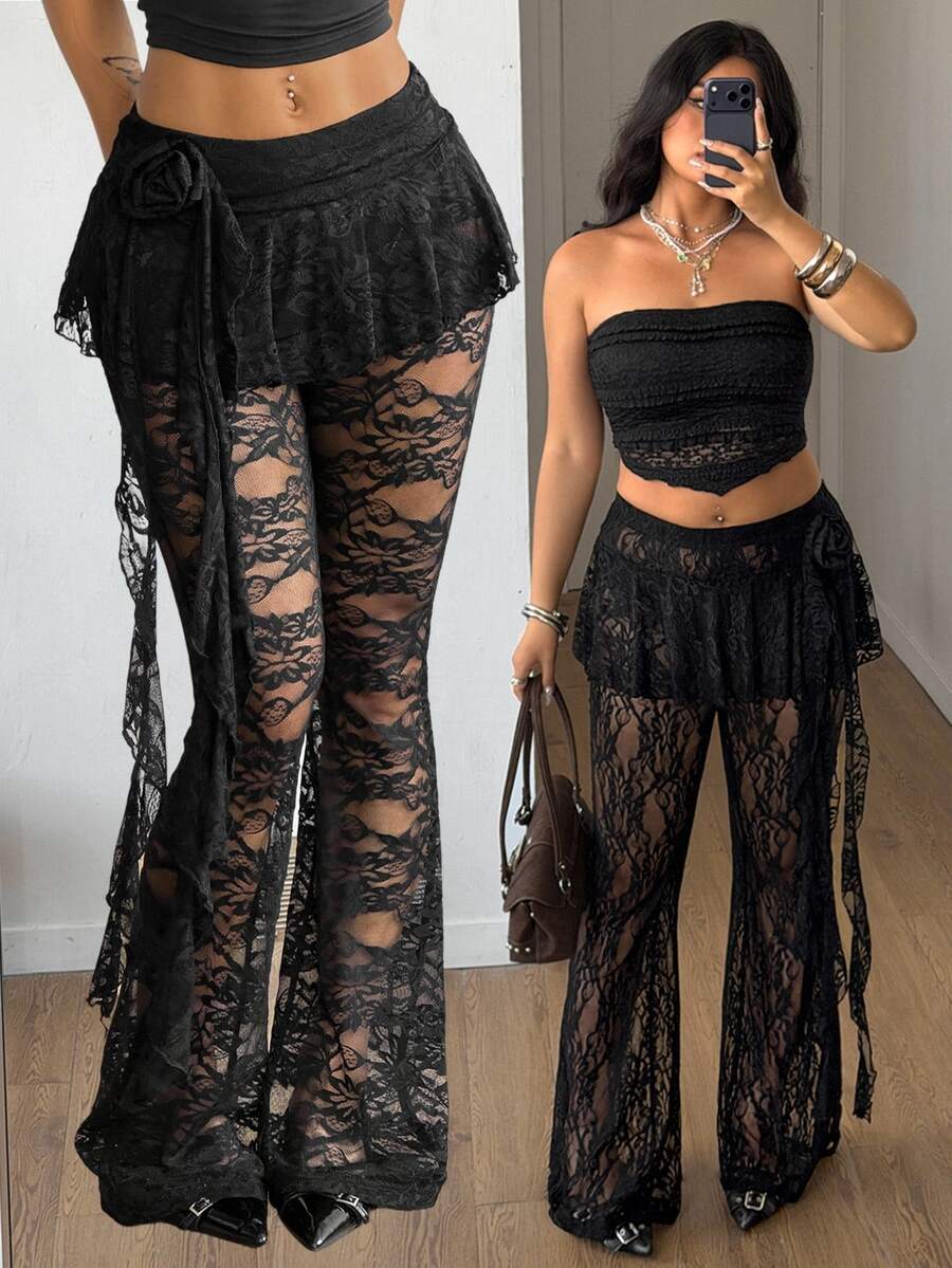 Black high-waist flare leg pants featuring contrast lace trim, floral ribbon detail, and semi-sheer knitted fabric.
